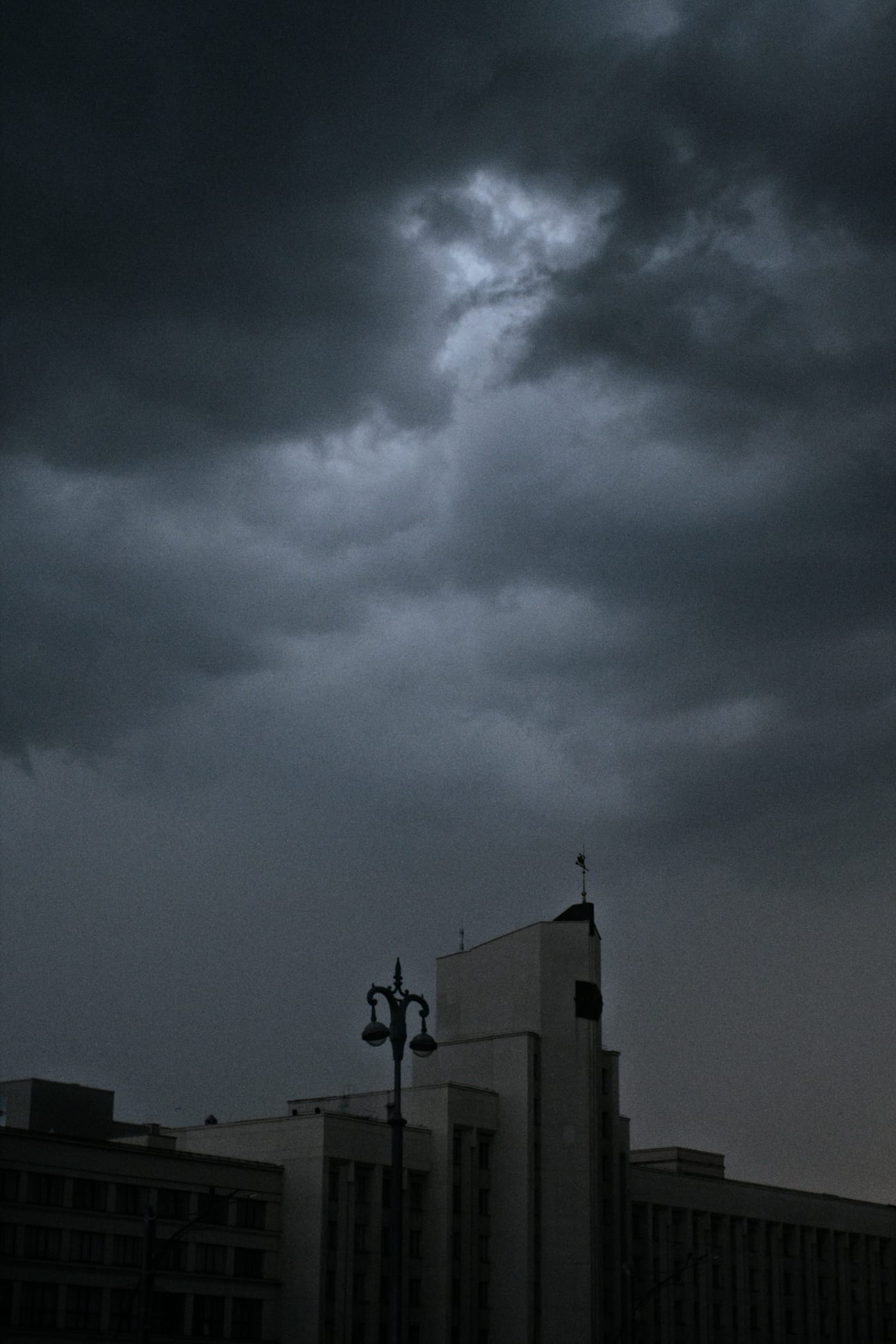A large thundercloud over a building in central Minsk